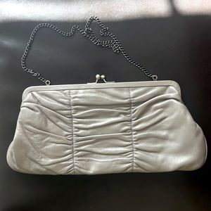 HOBO International clutch purse in light gold with pattern inside.